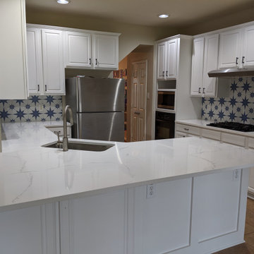 White kitchen - calcatta quartz, Salerno tile and extended cabinetry