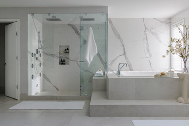 Bathroom - huge modern master white tile and porcelain tile ceramic tile, white floor and double-sink bathroom idea in Calgary with flat-panel cabinets, gray cabinets, a wall-mount toilet, white walls, an undermount sink, quartz countertops, a hinged shower door, white countertops and a built-in vanity