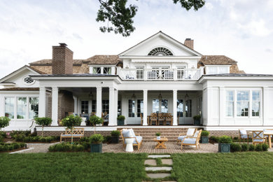 Design ideas for a large and white two floor detached house in Louisville with a shingle roof, a brown roof and board and batten cladding.