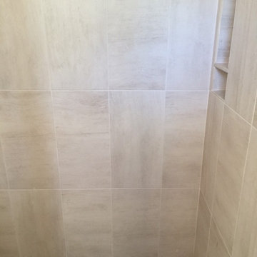 Stone Mosaic Flooring and Large Shower Wall Tile