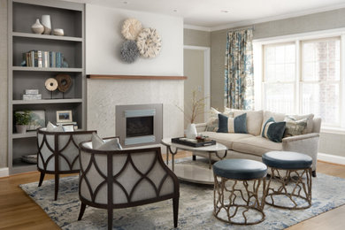 Example of a mid-sized classic open concept medium tone wood floor, brown floor and wallpaper living room design in Baltimore with a standard fireplace and no tv
