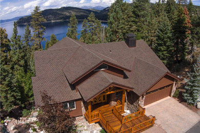 House exterior photo in Seattle with a shingle roof and a brown roof