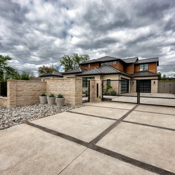 Custom Metal Fence & Electric Driveway Gate with Stone Accents