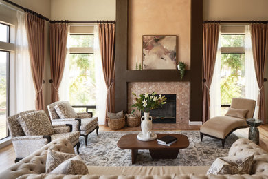 Inspiration for a transitional medium tone wood floor and brown floor living room remodel in San Francisco with beige walls, a standard fireplace and a tile fireplace