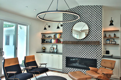 Inspiration for a large contemporary open concept medium tone wood floor and brown floor family room remodel in San Francisco with white walls, a standard fireplace, a tile fireplace and no tv