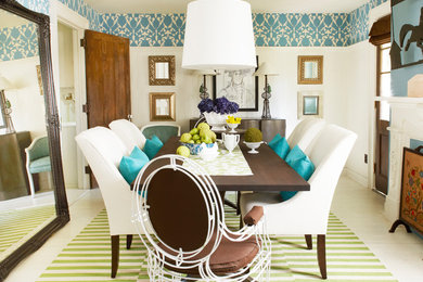 Example of an eclectic white floor enclosed dining room design with blue walls
