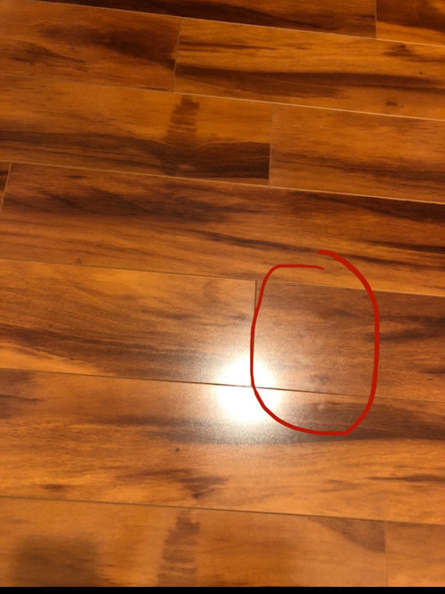 Weird white marks on my laminate floor - how do I get this off?!