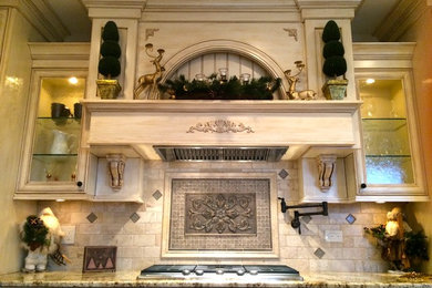 Inspiration for a mediterranean eat-in kitchen remodel in Chicago with granite countertops, stainless steel appliances and an island