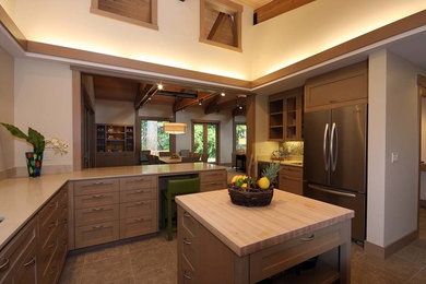This is an example of a large arts and crafts u-shaped eat-in kitchen in Seattle with shaker cabinets, light wood cabinets, with island, quartz benchtops, beige splashback, mosaic tile splashback, stainless steel appliances, an undermount sink, ceramic floors and beige floor.
