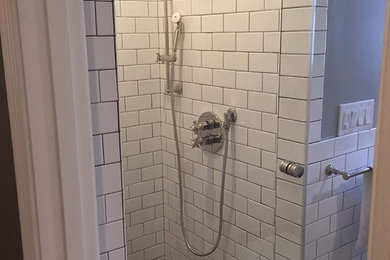 Alcove shower - transitional white tile and subway tile alcove shower idea in San Francisco