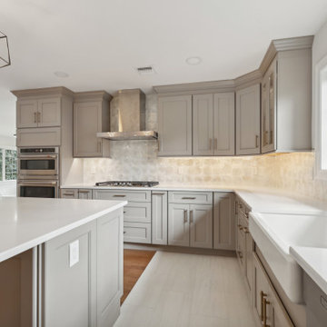 Kitchen with Farmhouse Sink and Gold Faucet