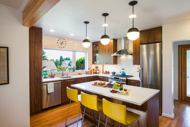 This is an example of a small midcentury l-shaped kitchen in Portland.