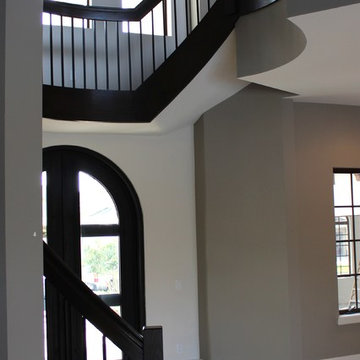Custom Curved White Oak Staircase, Square Iron Balusters