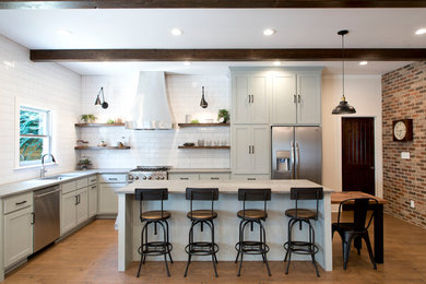 Photo of a large country kitchen in Atlanta with porcelain floors.