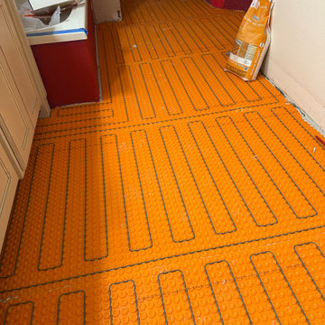 Curd-less walk-in shower; heated floors in bathroom + shower+bench LED