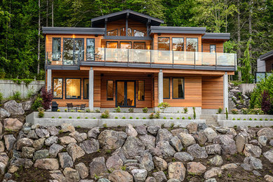 Inspiration for a contemporary exterior in Vancouver with wood siding.