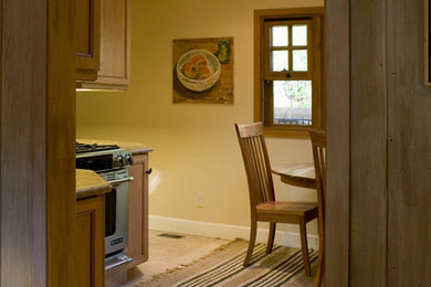 Arts and crafts u-shaped eat-in kitchen photo in San Francisco with an undermount sink, recessed-panel cabinets, medium tone wood cabinets, granite countertops, yellow backsplash, ceramic backsplash and stainless steel appliances