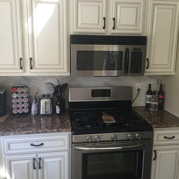 cabinet refacing antique white with granite and tile backsplash