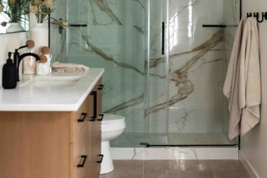 Minimalist beige tile and marble tile beige floor bathroom photo in Boise with white countertops