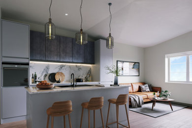 This is an example of a medium sized contemporary grey and black galley kitchen/diner in London with a built-in sink, flat-panel cabinets, grey cabinets, marble worktops, yellow splashback, marble splashback, black appliances, medium hardwood flooring, an island and white worktops.