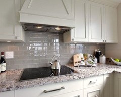 Need backsplash ideas for busy granite countertops in kitchen.