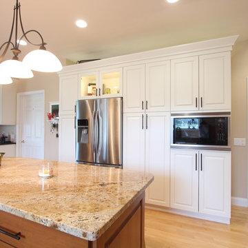 Built in Microwave on Wall of Pantry Cabinets and French Door Refrigerator
