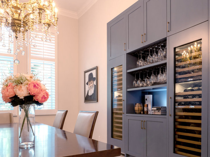 Medium-sized image of a transitional wine cellar with racks for displays