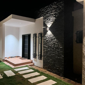 Villa Main Entrance Exterior – Textured Stone Feature Wall & Courtyard Entrance 