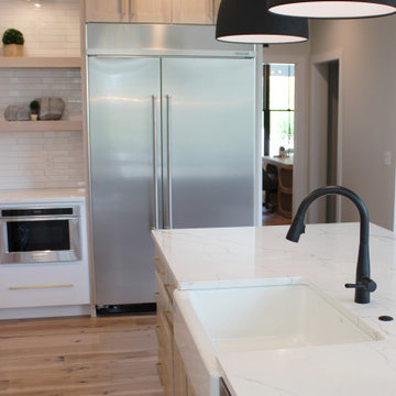 Oak, and White Kitchen with Matte Black Accents in Iowa Aspen Homes Farmhouse