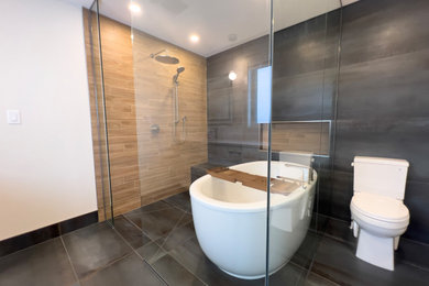 Large minimalist master blue tile and wood-look tile porcelain tile, blue floor and double-sink bathroom photo in Edmonton with recessed-panel cabinets, white cabinets, a two-piece toilet, white walls, an undermount sink, quartz countertops, white countertops and a built-in vanity