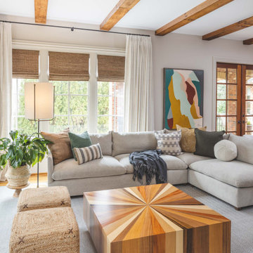 Layered Neutral Family Room with Architectural Beams