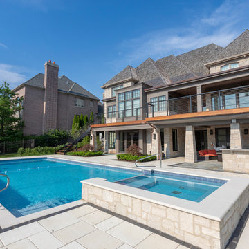 Burr Ridge Lap Pool with Raised Hot Tub and Waterfall