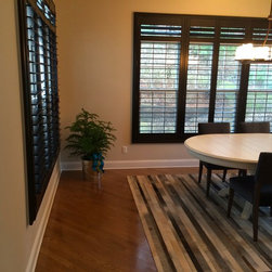 Black Plantation Shutters in dining room. - Interior Shutters