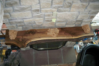 Example of a mountain style living room design in Seattle with a stone fireplace
