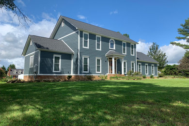 Mid-sized minimalist blue two-story mixed siding and clapboard exterior home photo in Birmingham