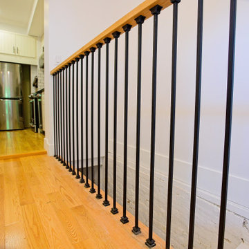 Oak Handrail and Black Balusters at the Kitchen Stair Opening | East York