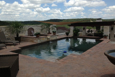 Tuscan pool photo in Austin