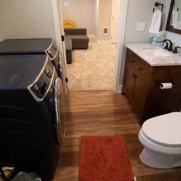 Bathroom/Laundry Room Using Warmer Tones, Accented by New Laundry Facility