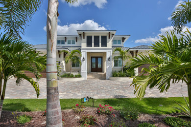 Beach style home design photo in Tampa