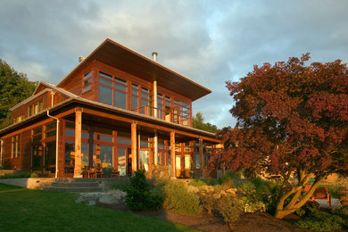 Contemporary two-story wood gable roof idea in Seattle