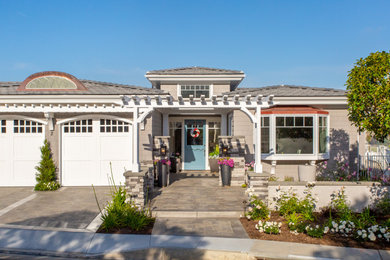 Example of a beach style home design design in Orange County