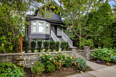 Inspiration for a contemporary three-storey black house exterior in Vancouver with mixed siding.
