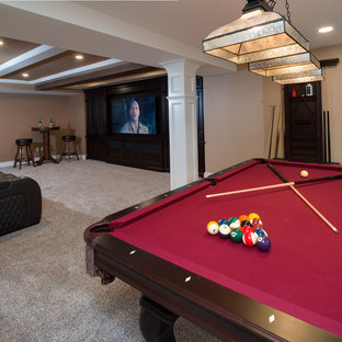 This is an example of a large traditional walk-out basement in Detroit with beige walls, porcelain flooring, a ribbon fireplace, a stone fireplace surround and brown floors.