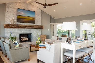 Large minimalist enclosed living room photo in Wilmington with a brick fireplace
