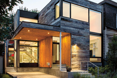 Contemporary two-storey brown exterior in San Francisco with mixed siding and a flat roof.