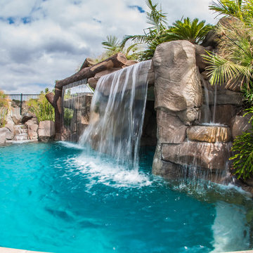 Tropical Beach Entry Pool & Spa with a Rock Slide & Grotto