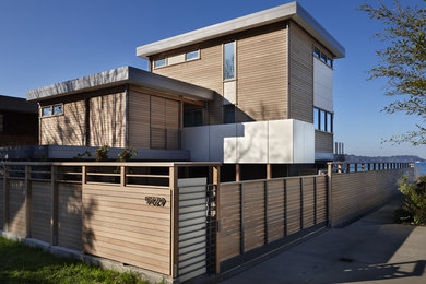 Trendy wood exterior home photo in Seattle