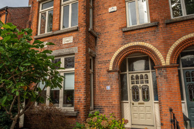 Modern brick semi-detached house in Dublin with three floors.