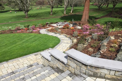 Design ideas for a large traditional partial sun backyard concrete paver landscaping in Other.