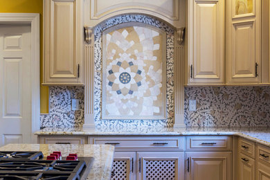 Large transitional kitchen photo in Boston with raised-panel cabinets, light wood cabinets, granite countertops, stainless steel appliances and an island